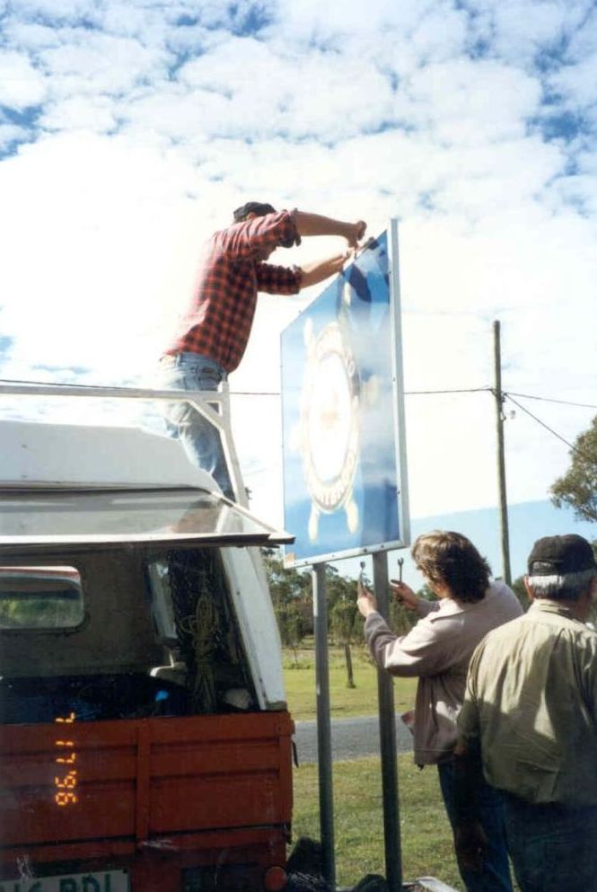 Members of the Donnybrook Progress Association erecting the Welcome to Donnybrook sign