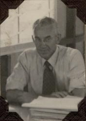 Male staff member sitting at desk