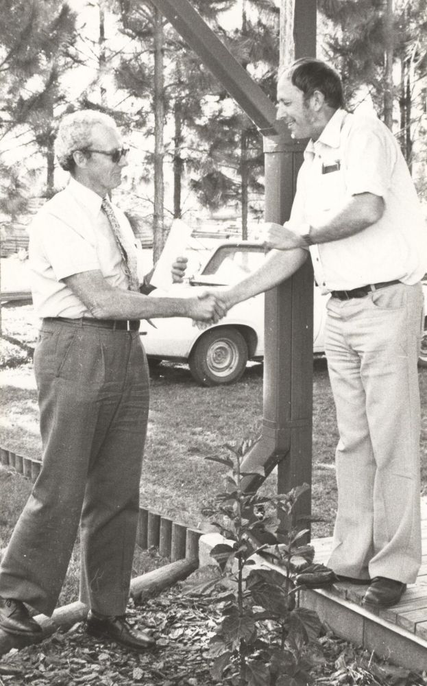 Charlie Peters with Peter Wilkinson receiving a safety award in the 1980s