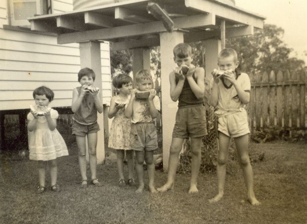 Wilkinson family children eating watermelon, ca. 1962