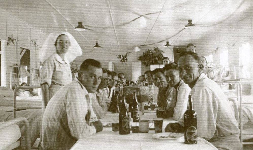 Nursing sister and patients inside the 12 bed hospital at Toorbul Point (Sandstone Point) during WWII