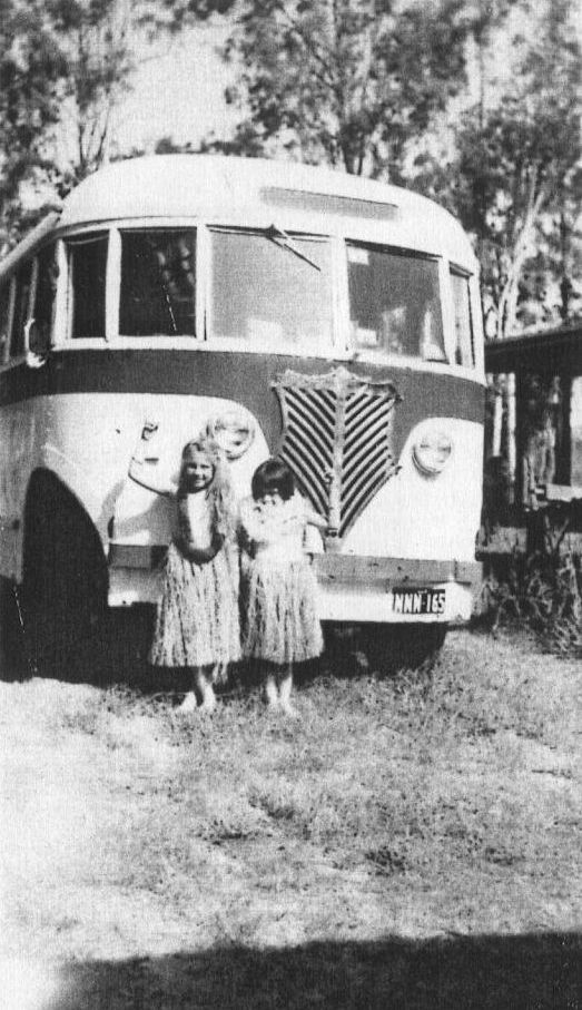 Joan and Valmai McLoughlin in front of one of Frank McLoughlin's Morayfield buses in 1961