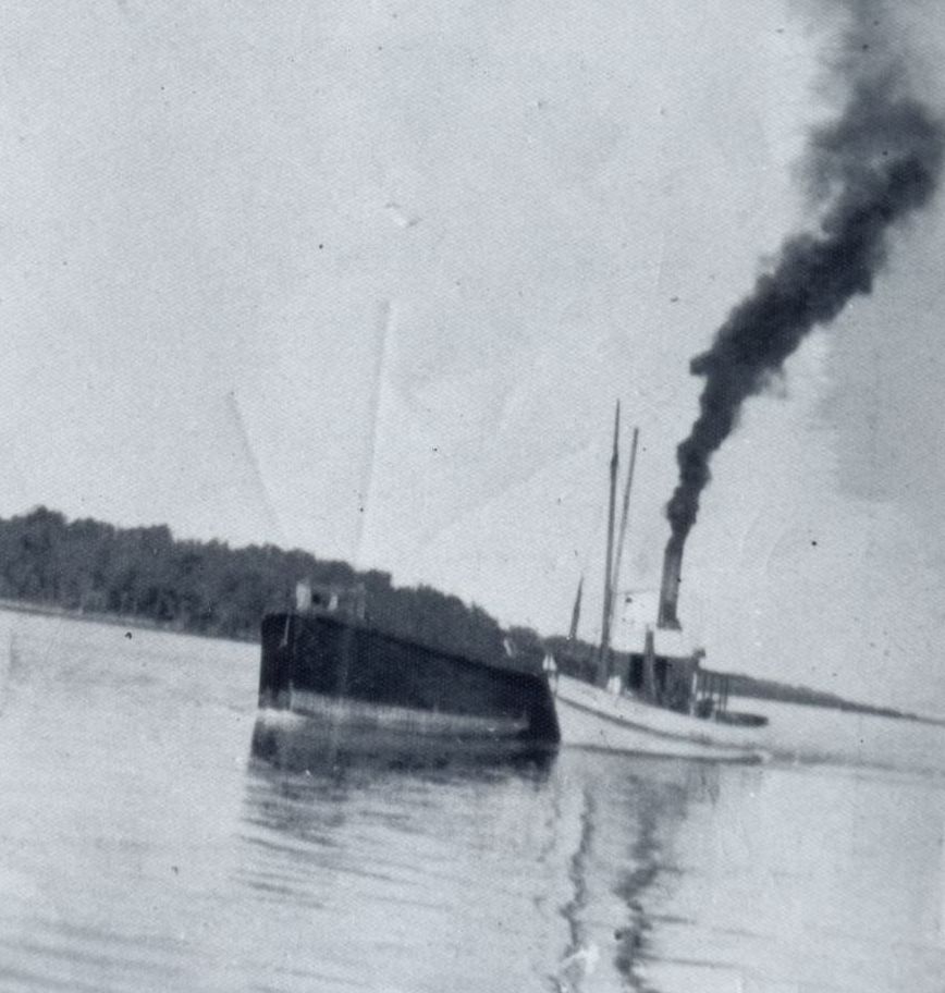 The boat named Sunrise and barge named Empress of Bribie off Bribie Island