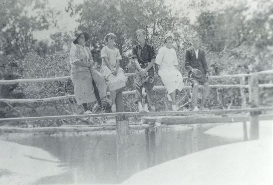 Sitting on the rails of North Shore Bridge across Shirley Creek