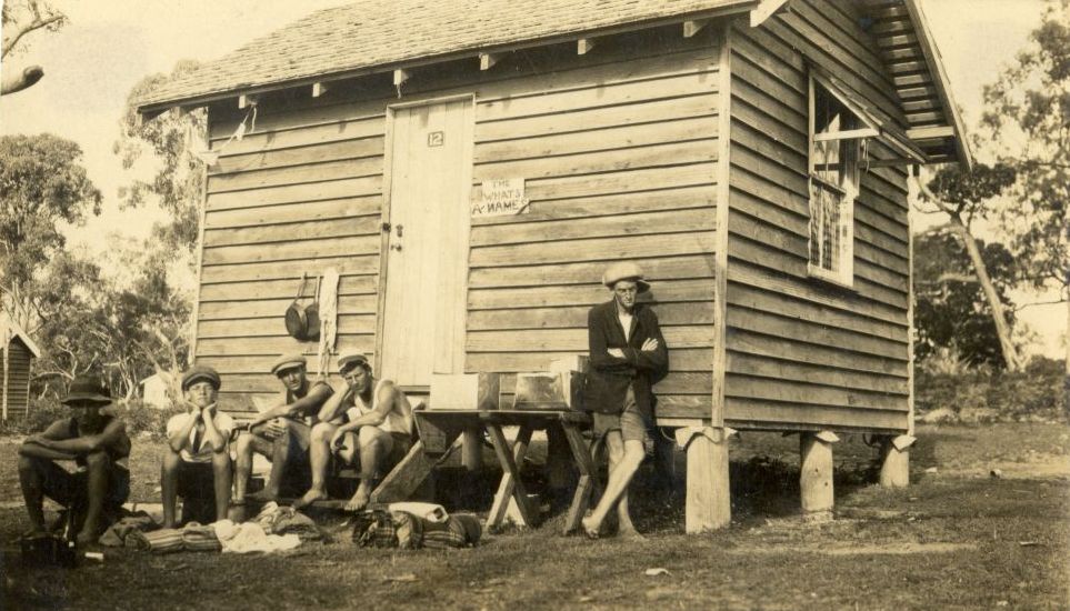 Walking Party arriving back at one of the holiday huts in Bongaree