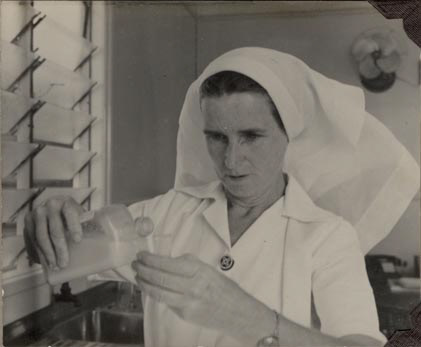 Nurse pouring medicine - Sister Parker
