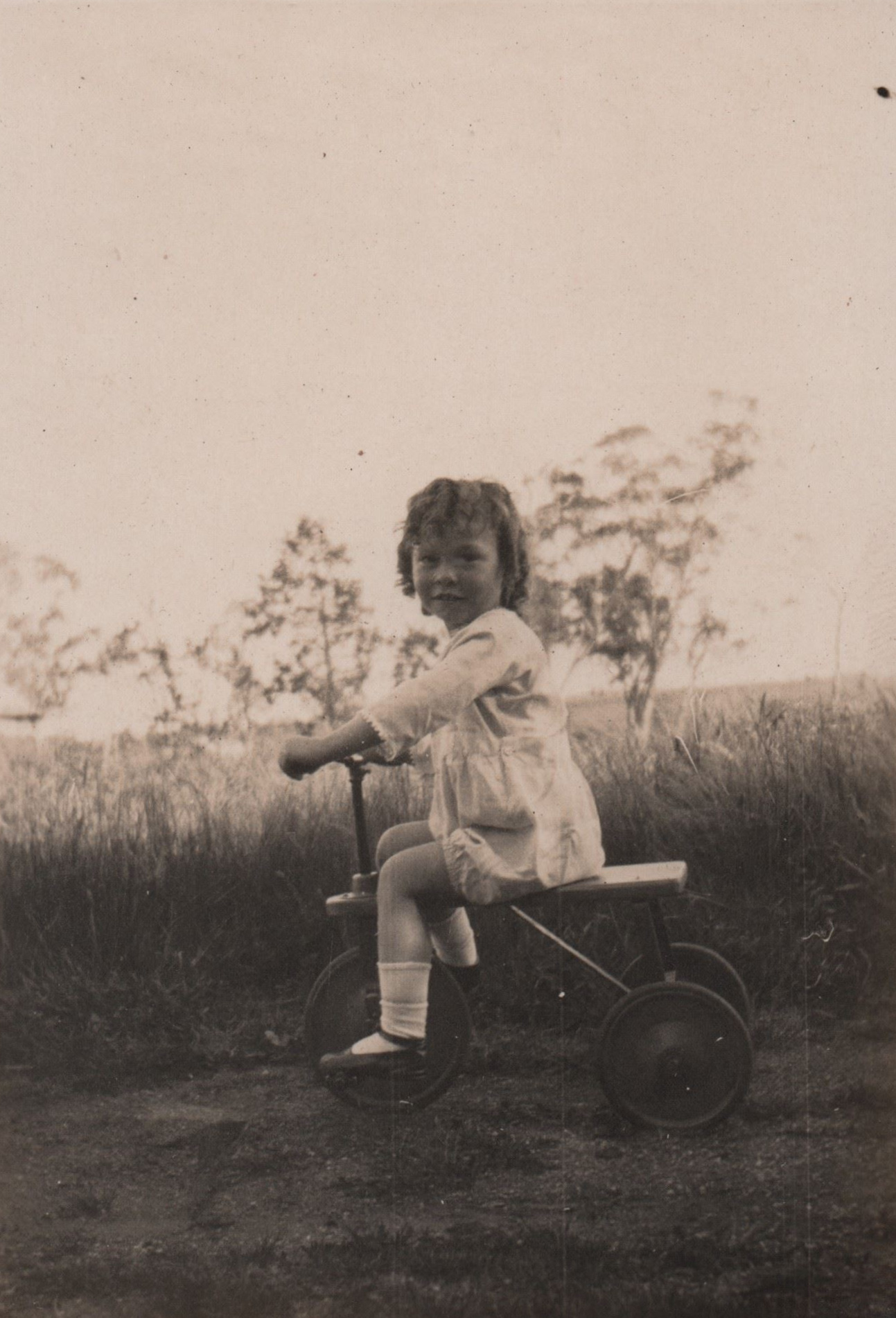 Small Girl on Tricycle