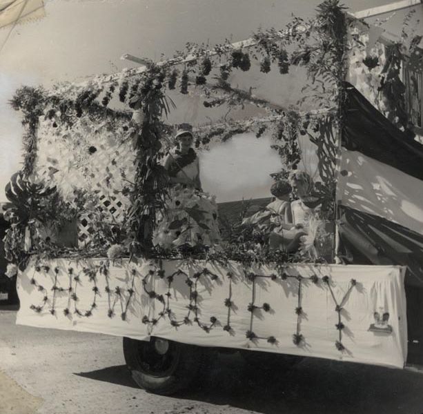 Miss Valda Cluff (Show Society Queen) on flower covered float