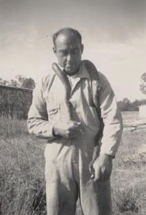 Worker with snake around his neck