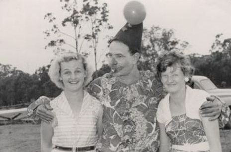 Clown with two unidentified women