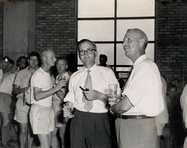 J.G. Wilson and Gus Gehrmann with workers
