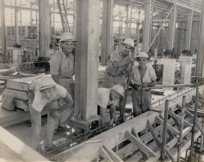 Workers fitting out building