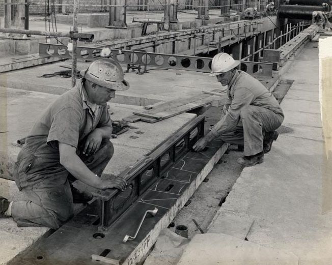 Workers fitting out building