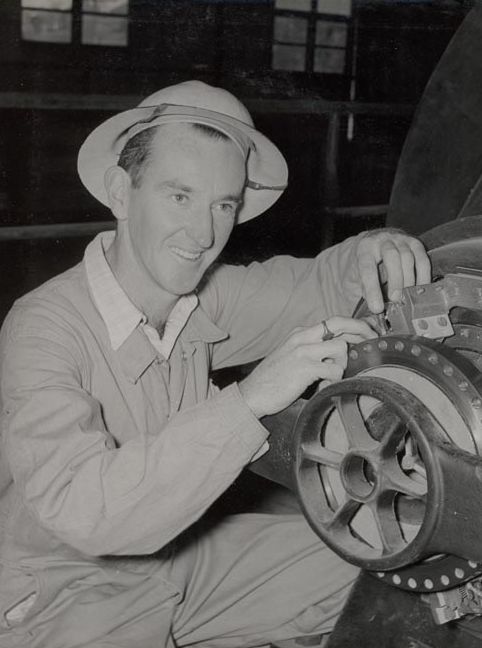 Male worker working on roller end - Unknown
