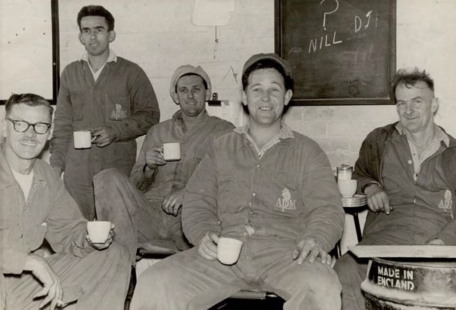 5 Male Workers having tea