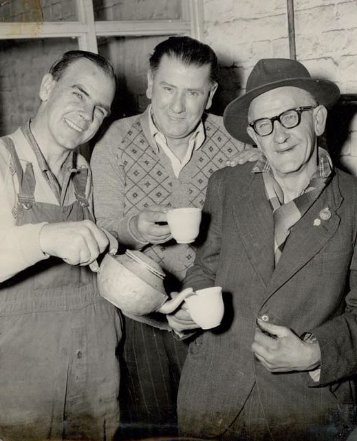 3 Workers sharing a cup of tea
