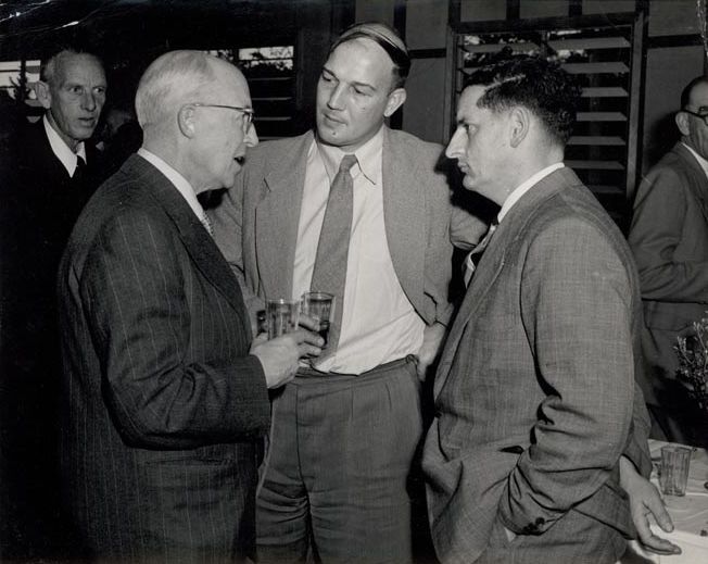 4 Men in suits talking