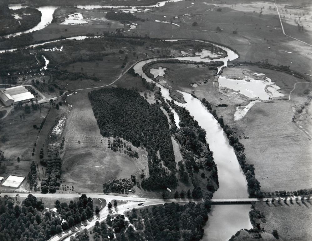 Aerial photograph looking east from the Gympie Road bridge over the North Pine River