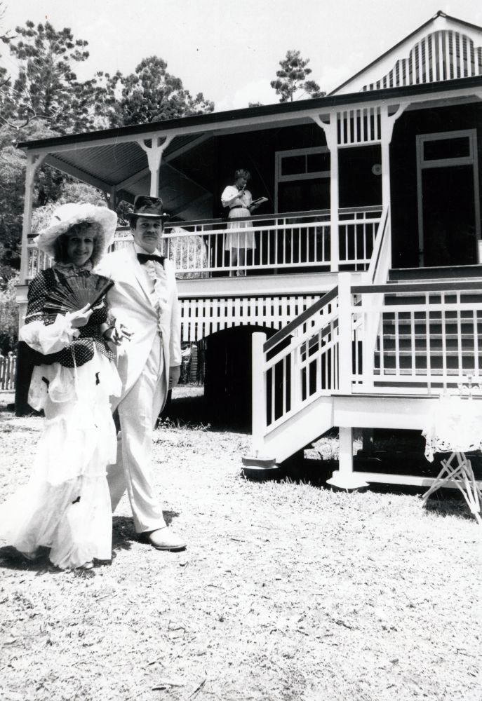 Two people in period costume outside Hyde Homestead, North Pine Country Park