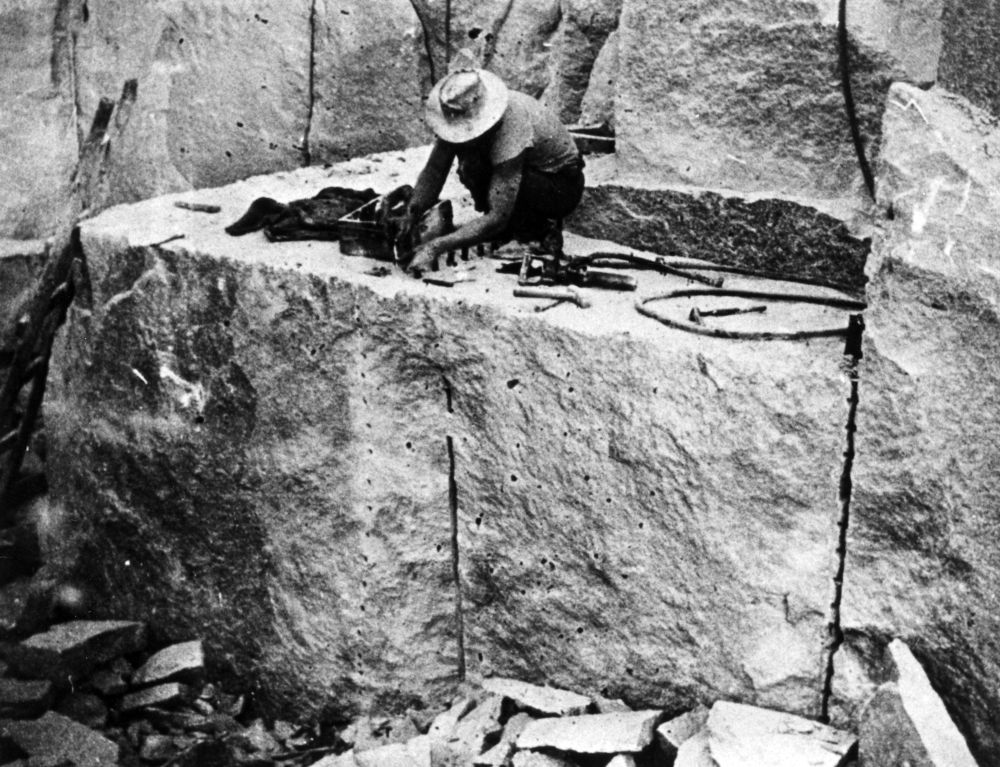 Laying splitting wedges at Camp Mountain Quarry, early 1920s
