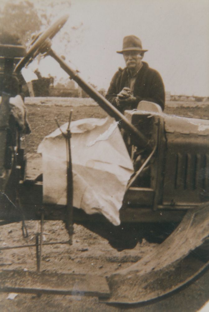 Mr Tom Quinn (father), working on his car, ca. 1928