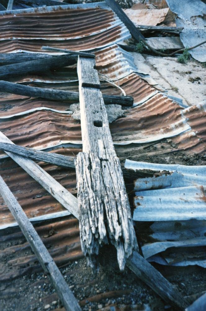 Very old pillar on the ground near the barn on Leitch's property