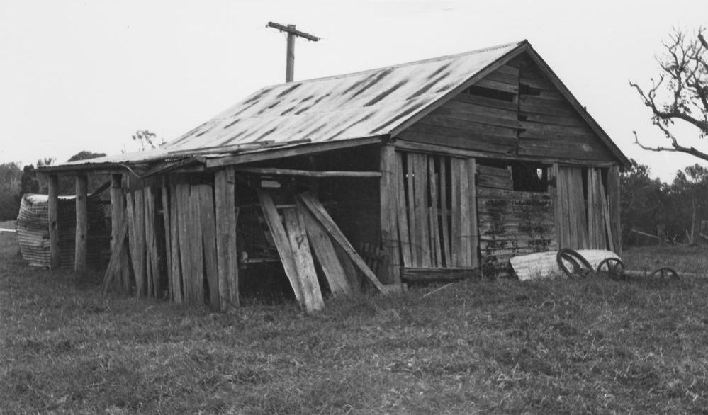 Front and side view of a slab barn on Hyde's property, 1976