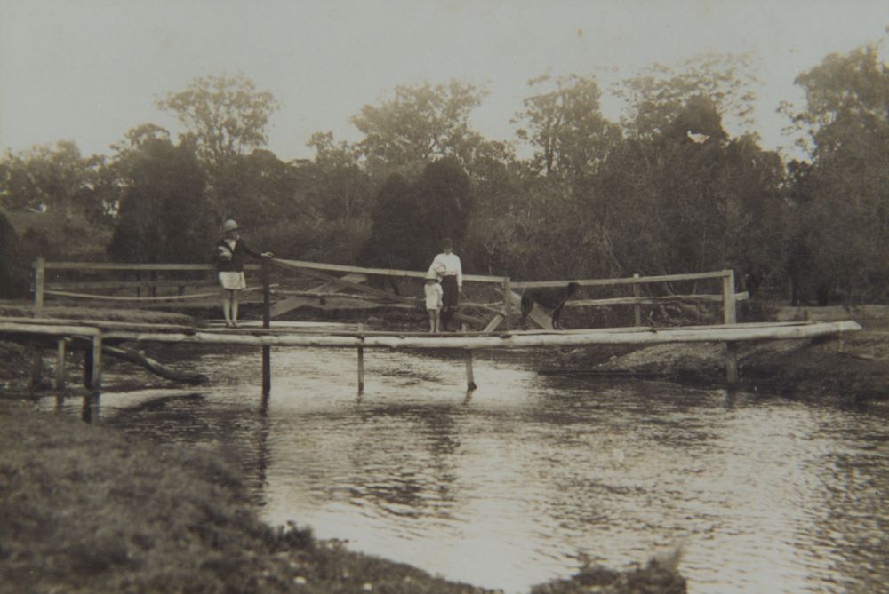 Old wooden footbridge across the North Pine River at Petrie, 1920s