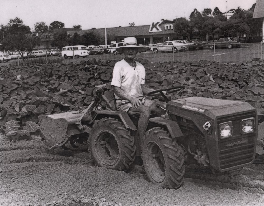 Mr Leslie Patrick riding a tractor