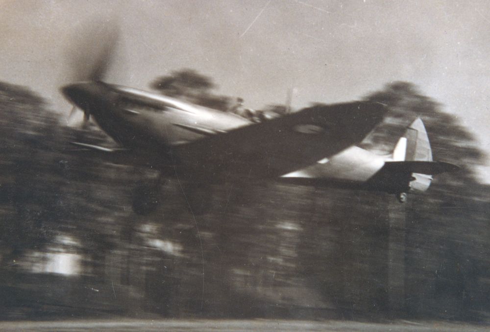 Spitfire taking off from the Strathpine A2 Airstrip (now Spitfire Avenue) during World War II, 1944