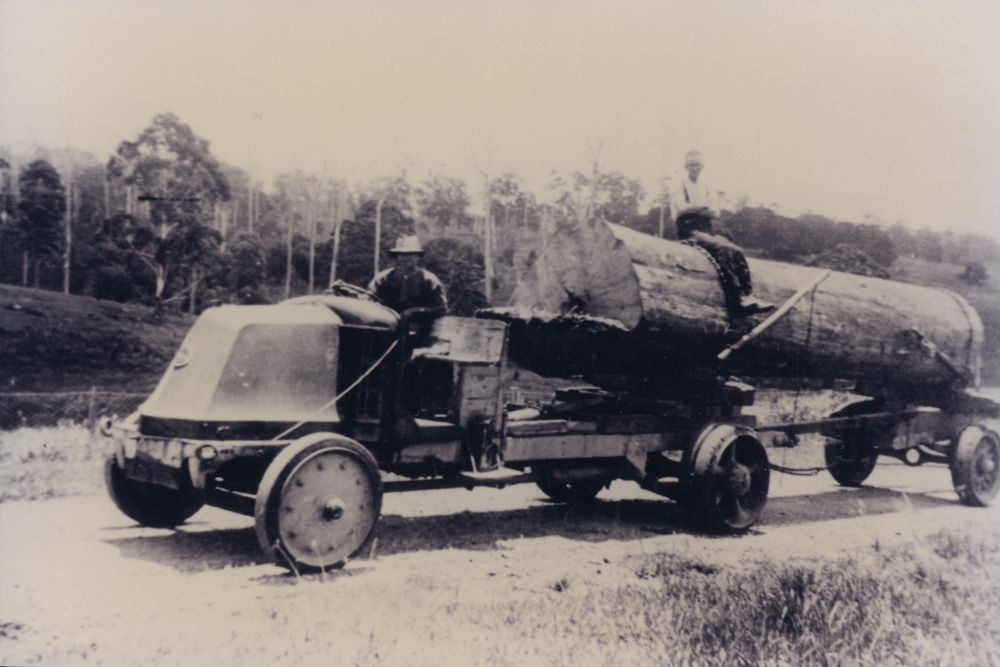 Mack logging truck with a large log, ca. 1920s