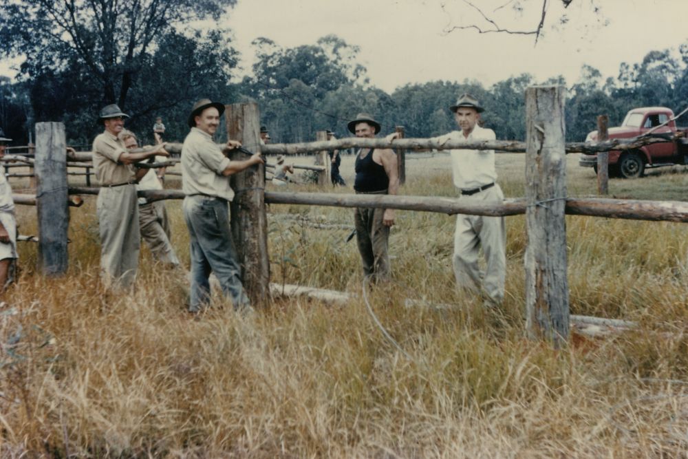 Group of men repairing a fence, ca. 1970