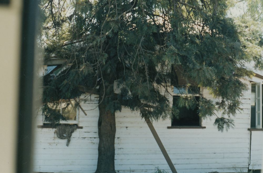 House washed from it foundations during floods in Charleville (Qld.), 1990