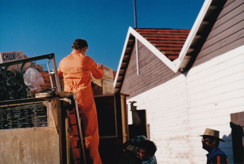 Unloading a truck loaded with donated items from the Charleville (Qld.) Flood Relief Fund, October 1990