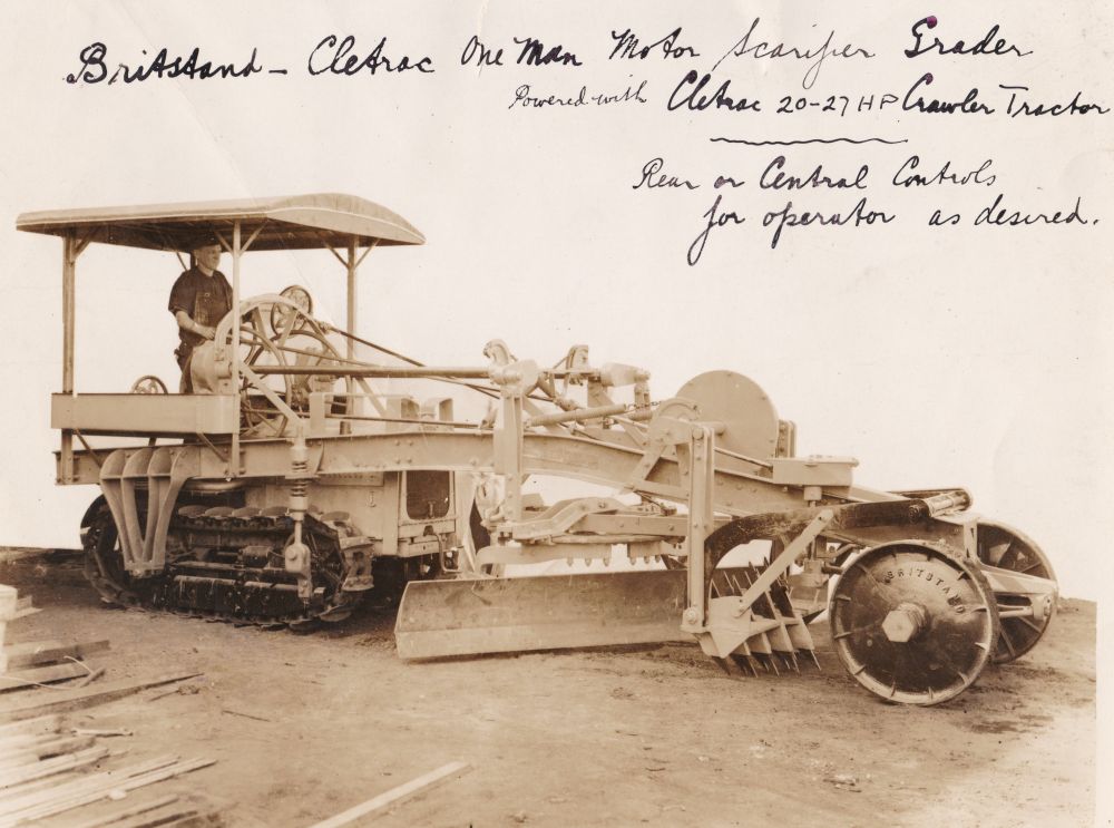 Man driving a British Standard Cletrac One Man Motor Scarifier Grader, ca. 1930