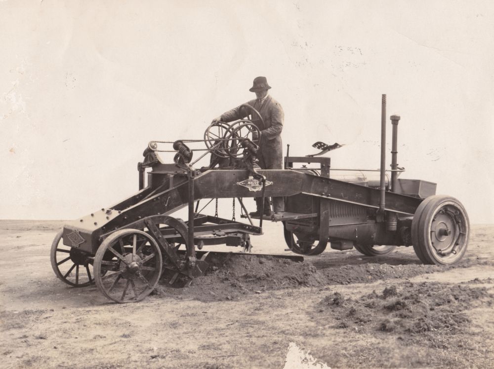 Man driving grader, ca. 1930