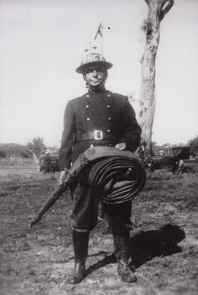Firefighter holding fire hose