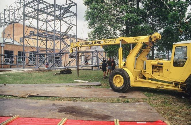 Working on steel frame construction outside building