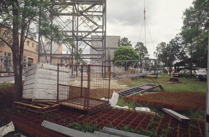 Working on steel frame construction outside building