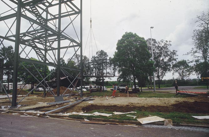 Working on steel frame construction outside building
