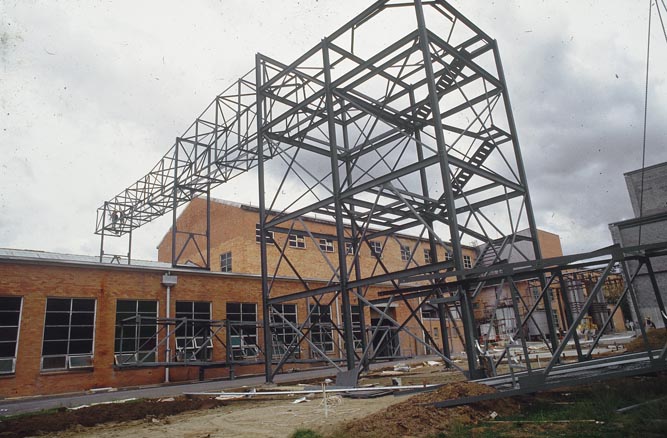 Working on steel frame construction outside building