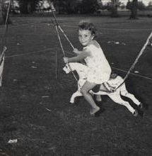 Christmas Party - Child on merry-go-round