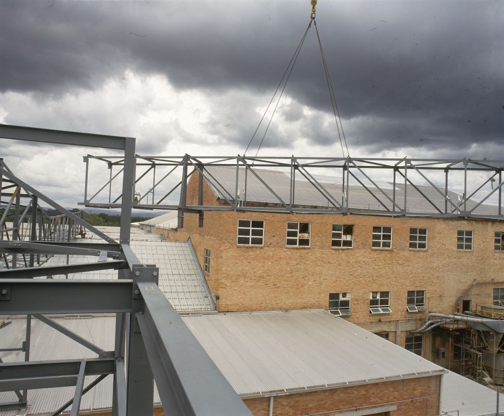 Working on steel frame construction outside building