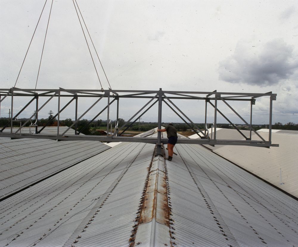 Working on steel frame construction outside building