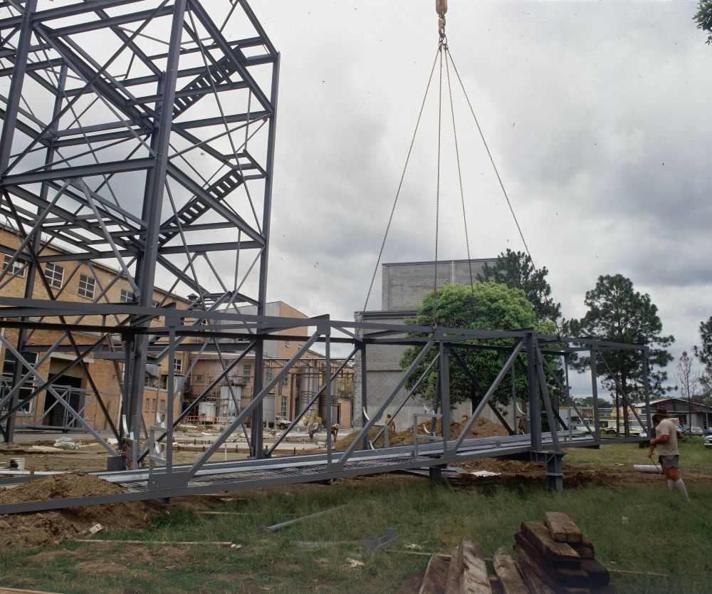 Working on steel frame construction outside building