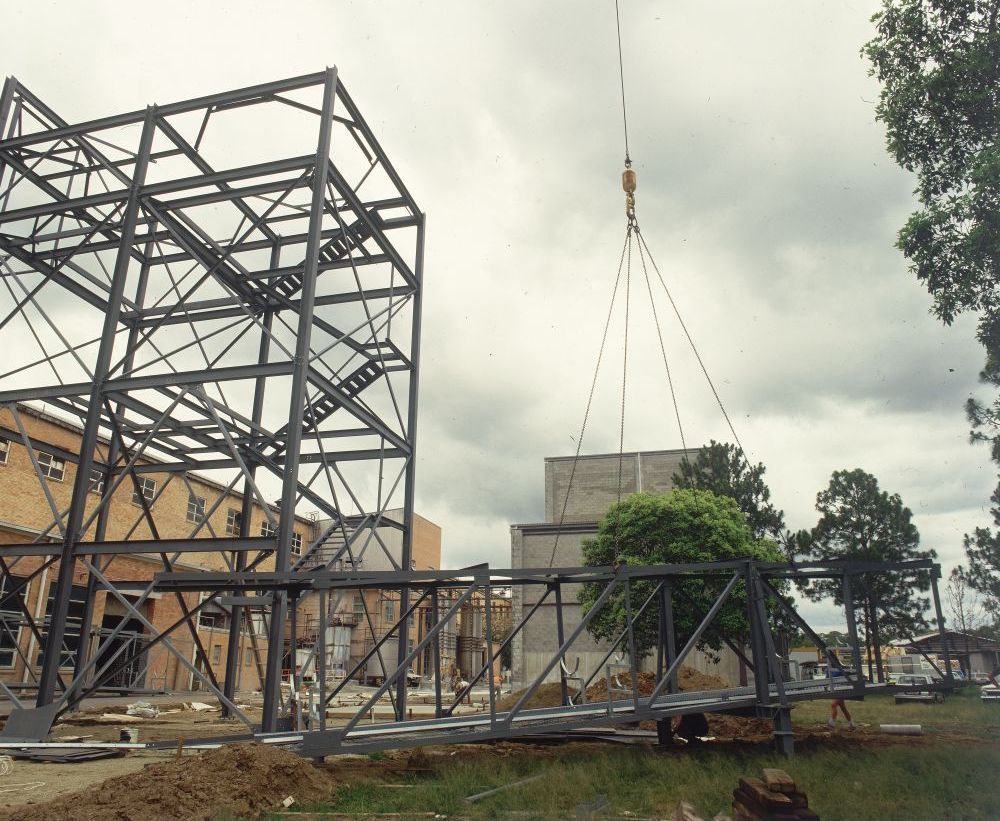 Working on steel frame construction outside building