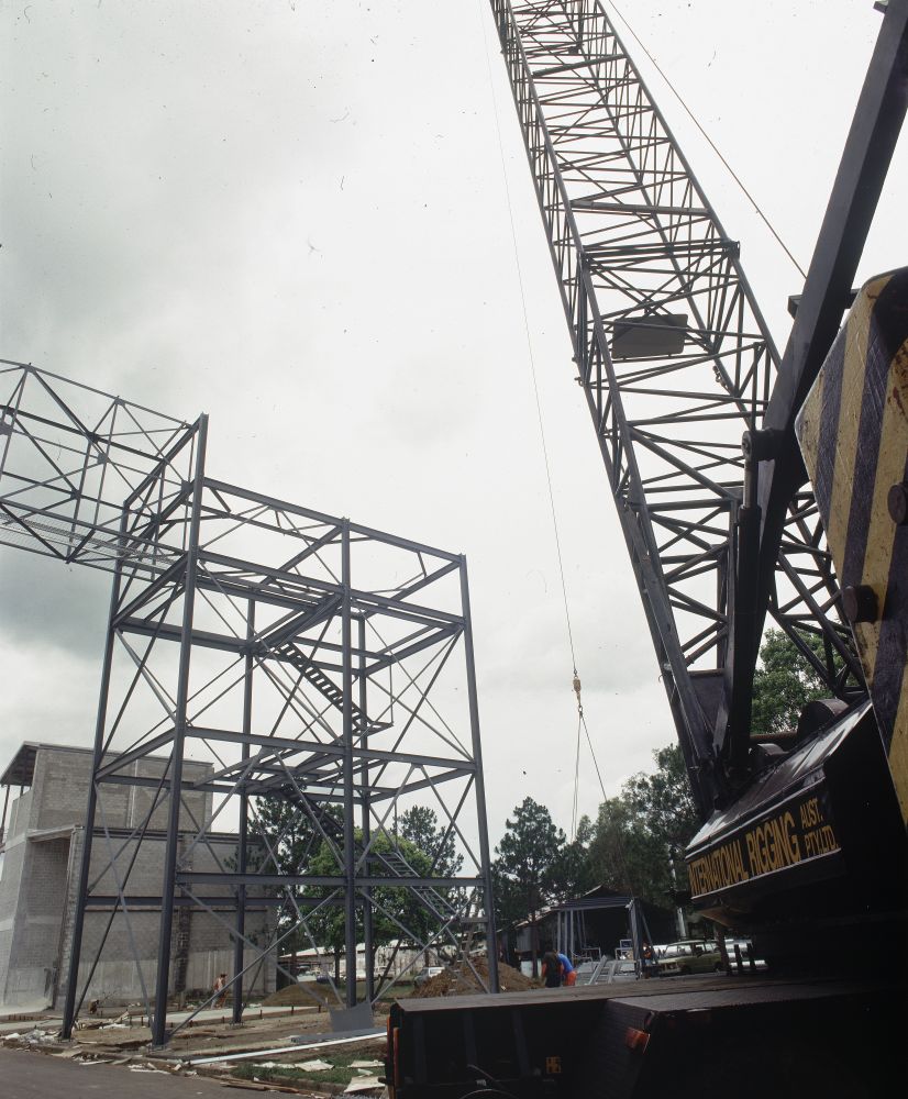 Working on steel frame construction outside building