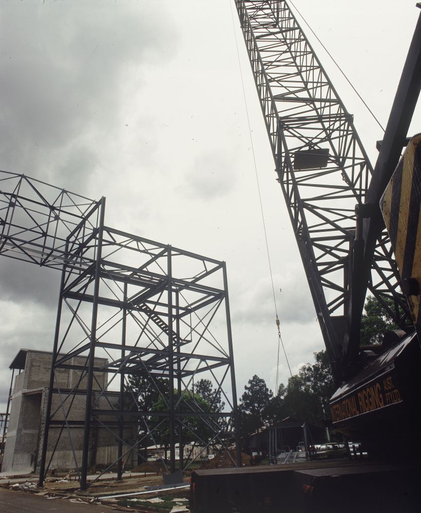 Working on steel frame construction outside building