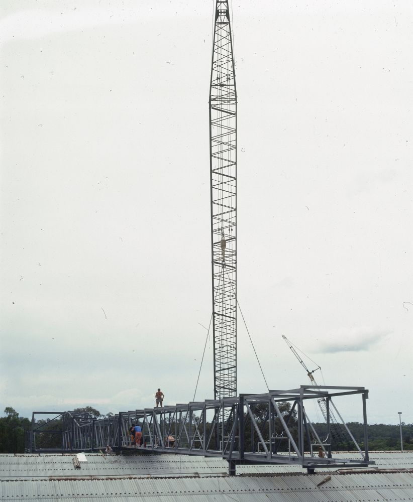 Working on steel frame construction outside building