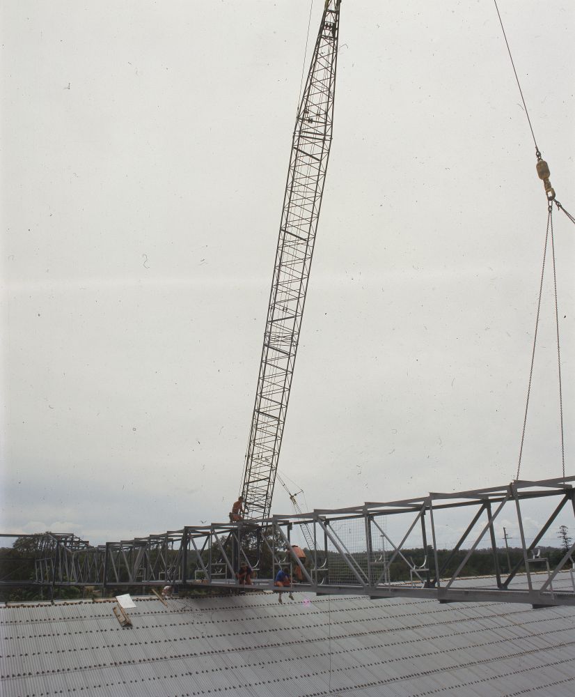 Working on steel frame construction outside building